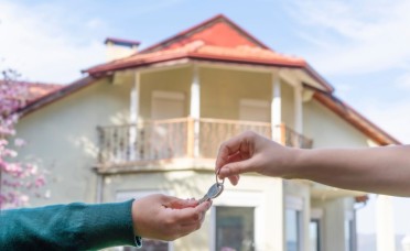 Seller handed over house key to the buyer