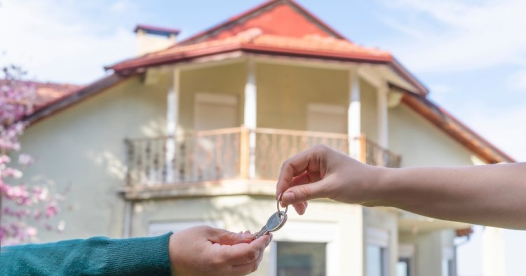 Seller handed over house key to the buyer