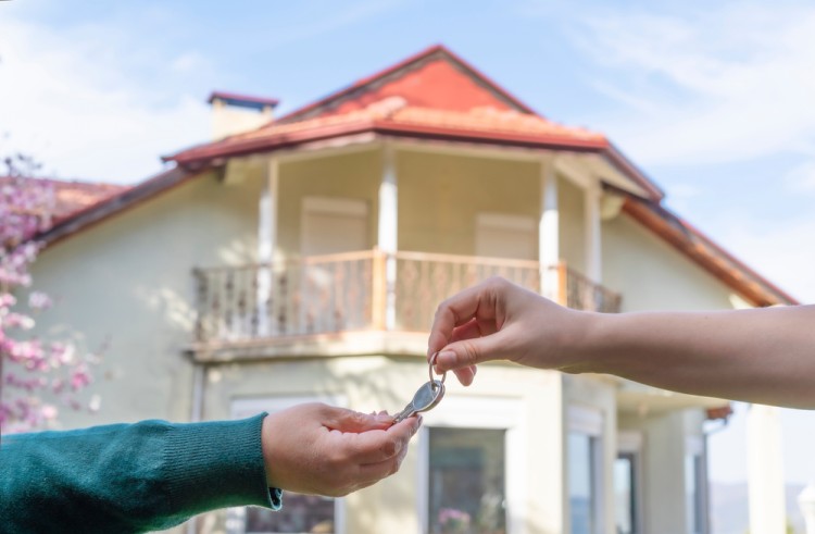 Seller handed over house key to the buyer